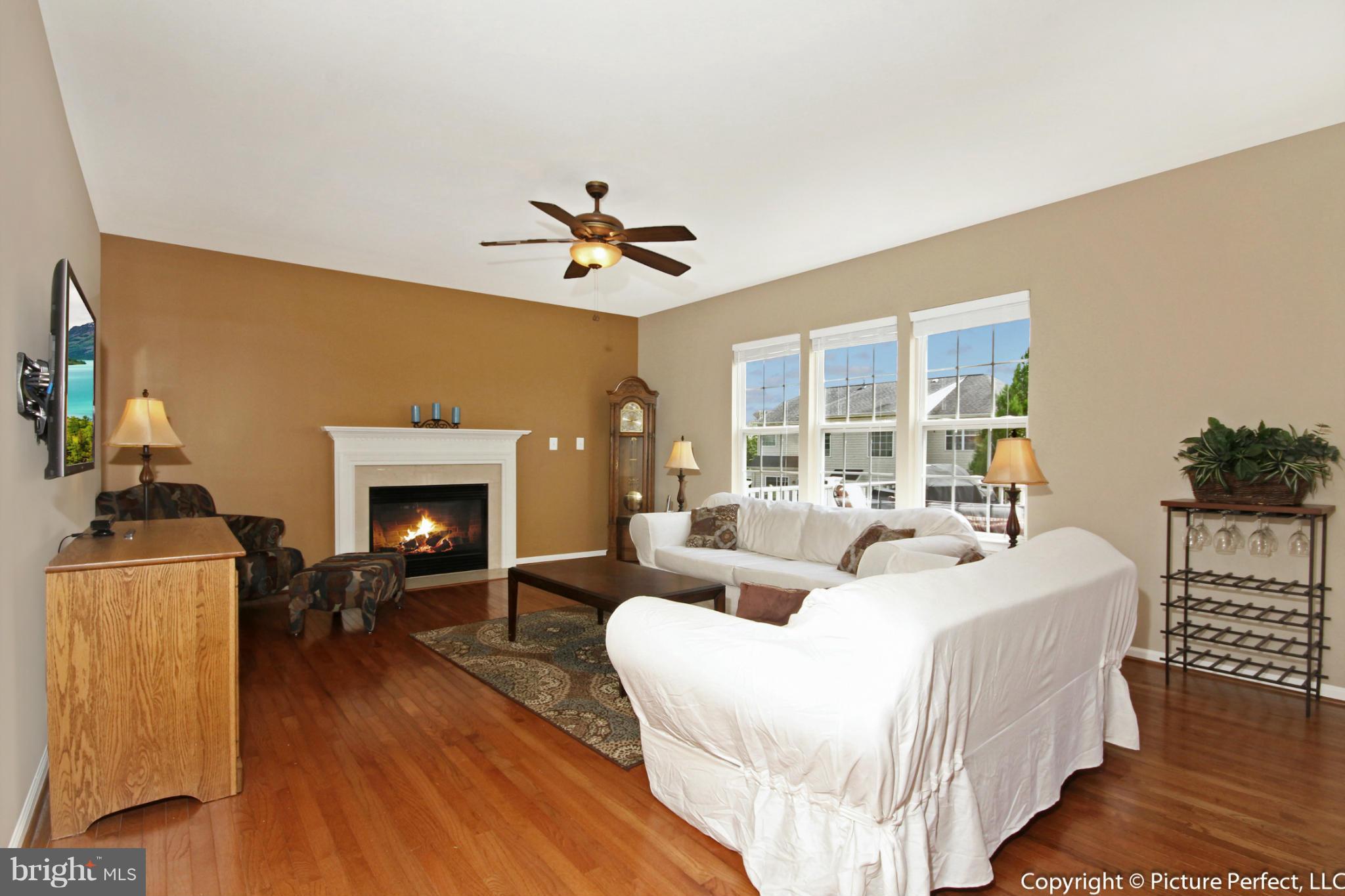 14308 Autumn Crest Road Boyds, MD 20841 - Photo 2 of 21 a living room with furniture and a fireplace
