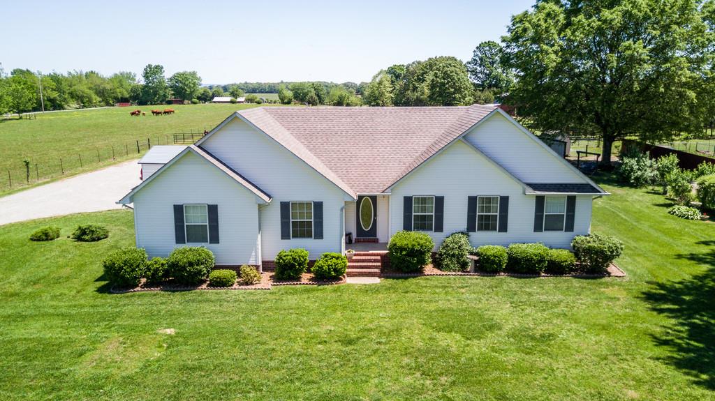 5004 Maple Springs Road Manchester, TN 37355 - Photo 1 of 22 a view of a house with a yard and potted plants