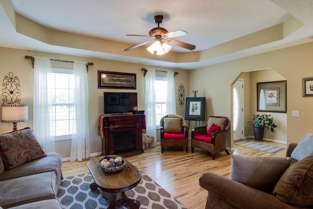 5004 Maple Springs Road Manchester, TN 37355 - Photo 14 of 22 a living room with furniture a flat screen tv and a window
