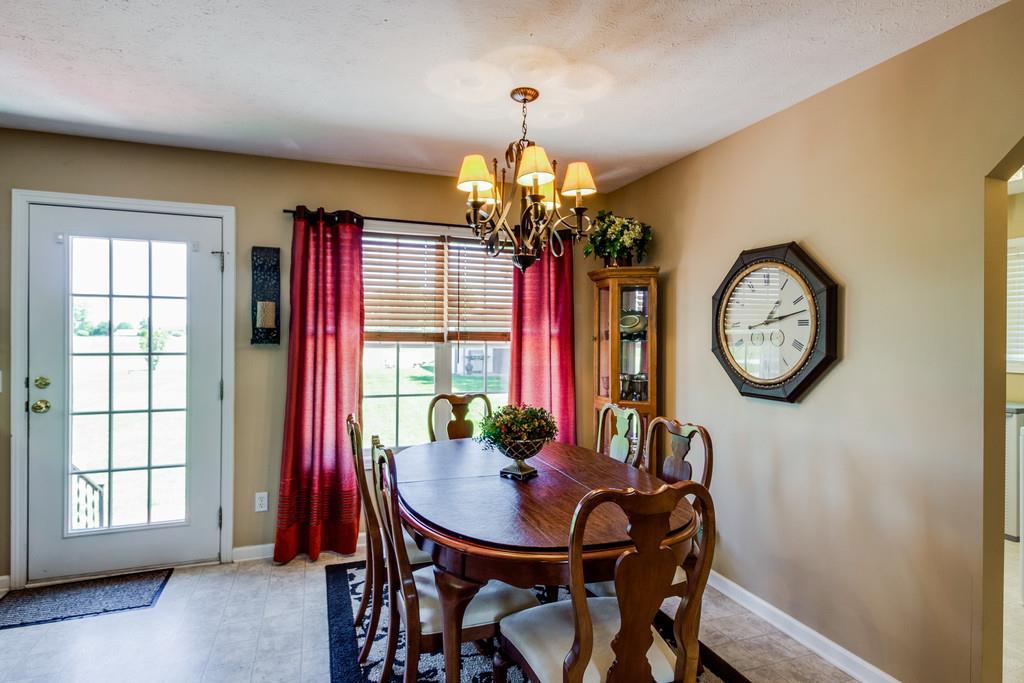 5004 Maple Springs Road Manchester, TN 37355 - Photo 16 of 22 a view of a dining room with furniture window and wooden floor