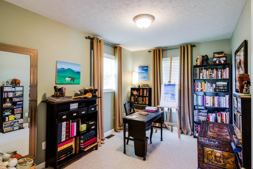 5004 Maple Springs Road Manchester, TN 37355 - Photo 22 of 22 a room with furniture a bookshelf and a window