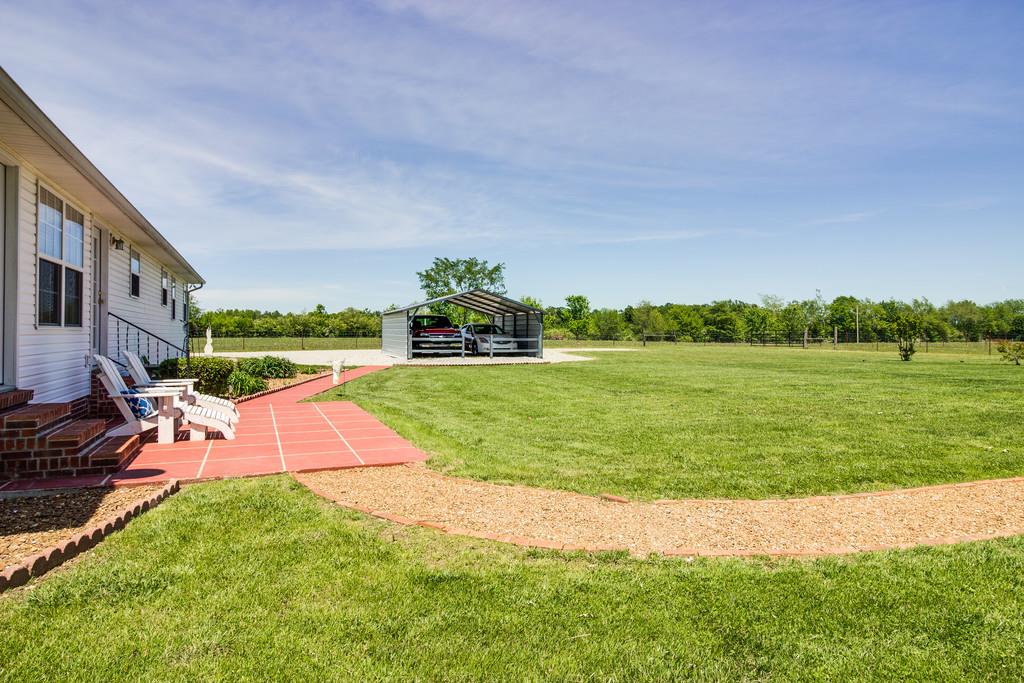 5004 Maple Springs Road Manchester, TN 37355 - Photo 4 of 22 a view of yard with swimming pool and green space
