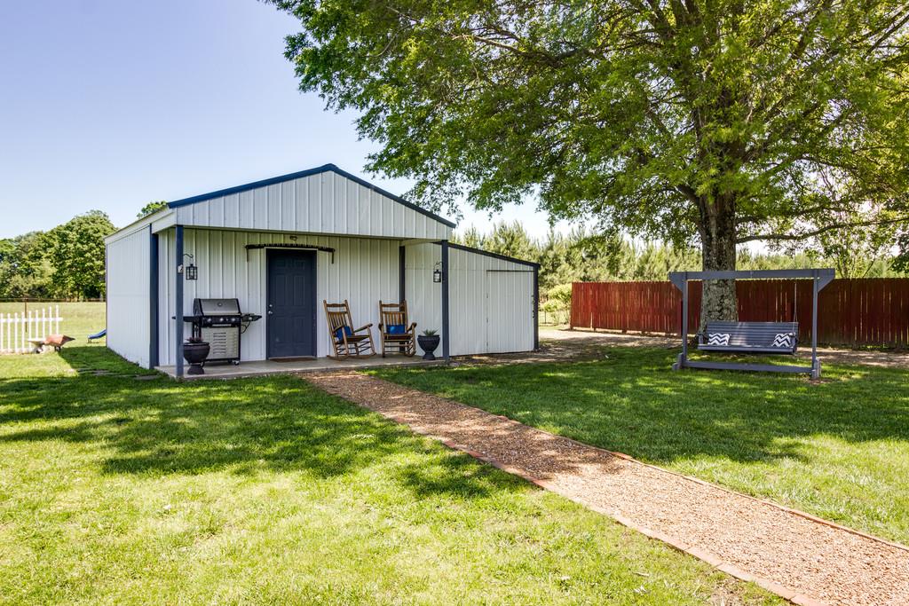 5004 Maple Springs Road Manchester, TN 37355 - Photo 6 of 22 a view of a house with backyard and sitting area