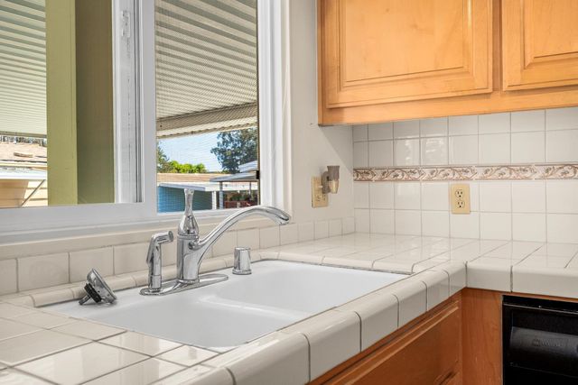 a bathroom with a sink and a window