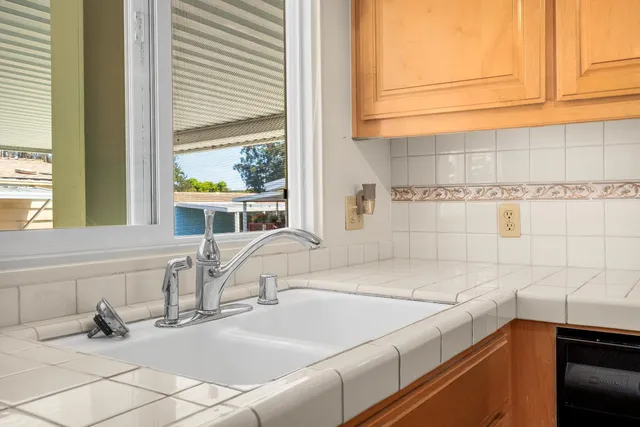 a bathroom with a sink and a window