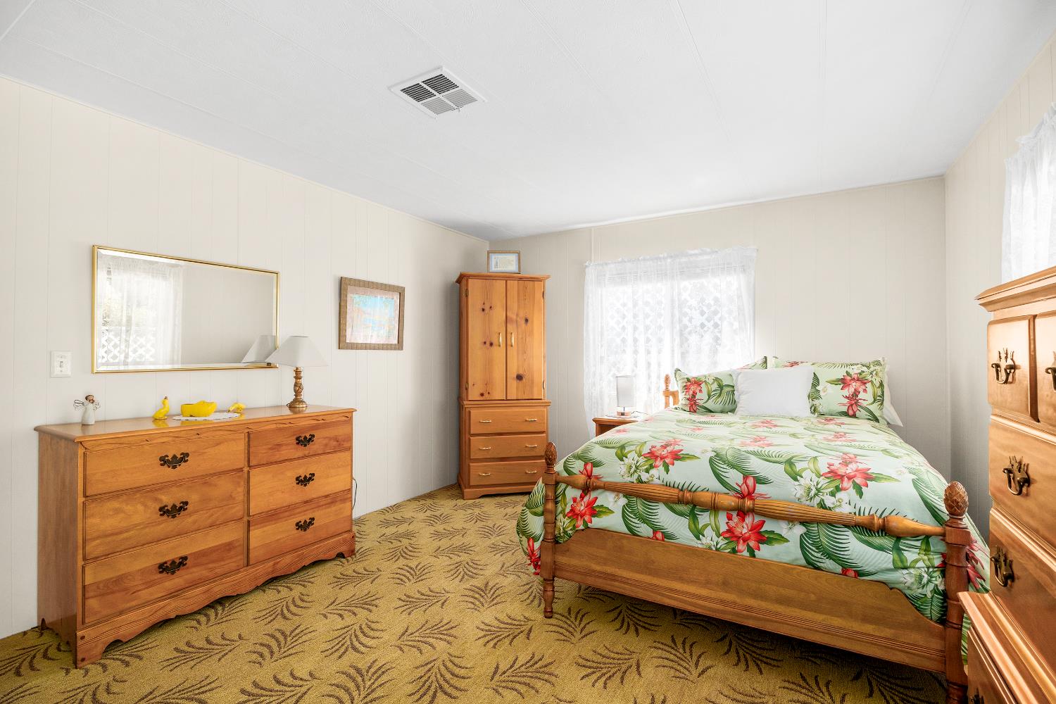 2435 Felt Street, Unit 24 Santa Cruz, CA 95062 - Photo 15 of 38 a bedroom with a bed and a dresser in it