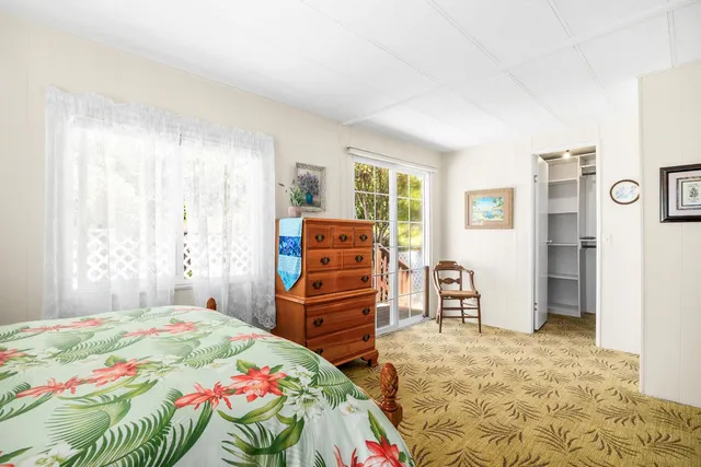 a bedroom with a bed and furniture