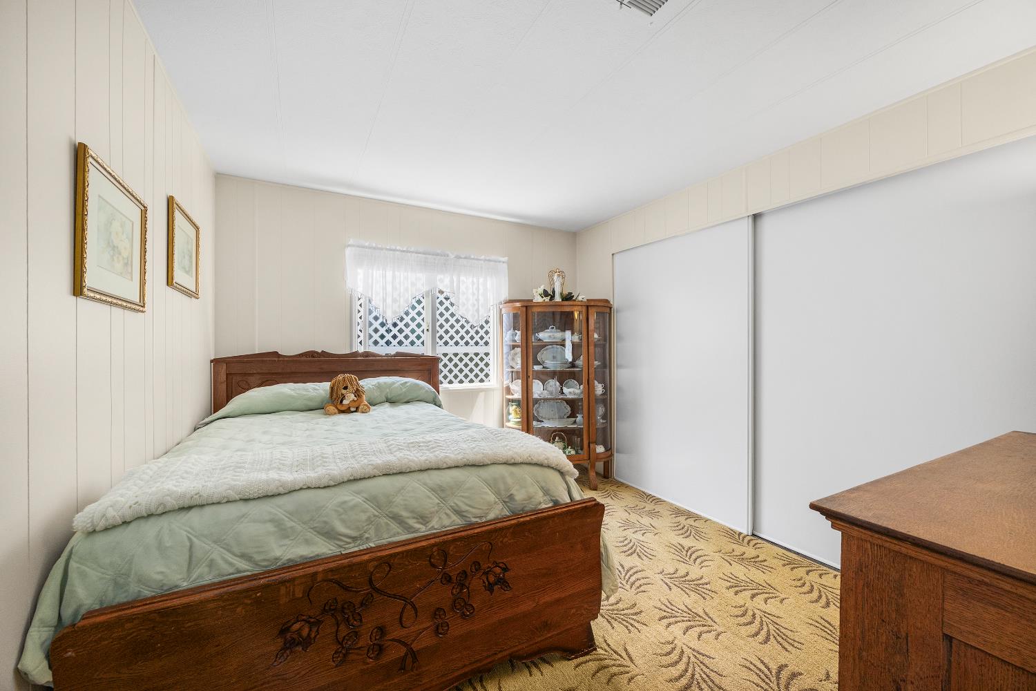 2435 Felt Street, Unit 24 Santa Cruz, CA 95062 - Photo 22 of 38 a bedroom with a bed and a cabinets