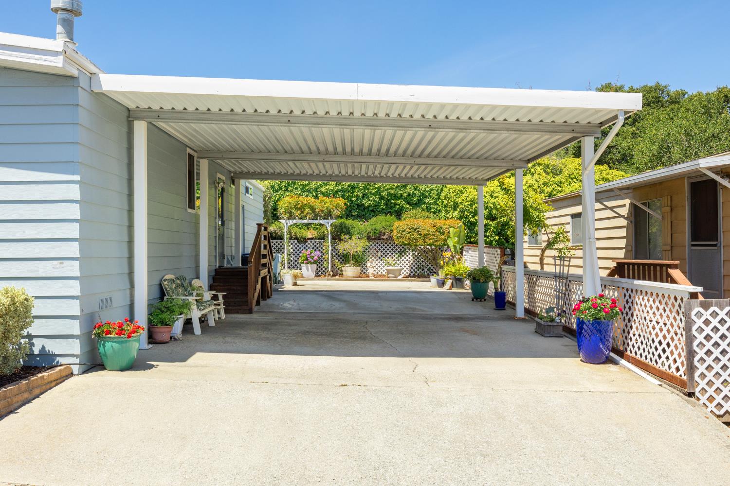 2435 Felt Street, Unit 24 Santa Cruz, CA 95062 - Photo 28 of 38 a view of a patio with a table and chairs under an umbrella