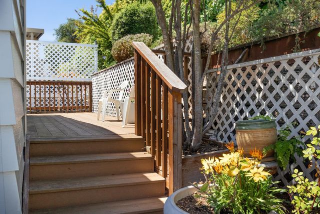 a view of a balcony with wooden floor