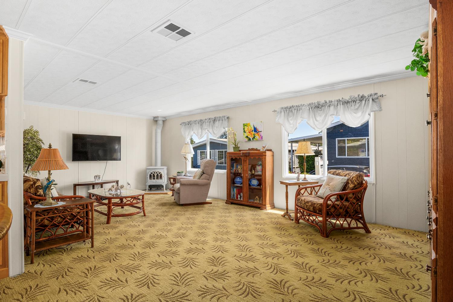 2435 Felt Street, Unit 24 Santa Cruz, CA 95062 - Photo 3 of 38 a living room with furniture and a flat screen tv