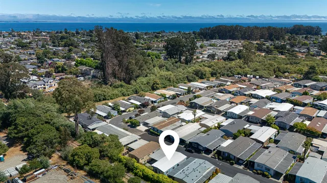 an aerial view of a house with a swimming pool