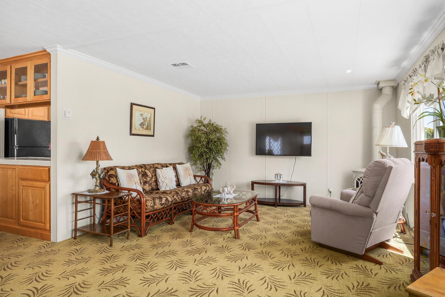 2435 Felt Street, Unit 24 Santa Cruz, CA 95062 - Photo 5 of 38 a living room with furniture and a flat screen tv