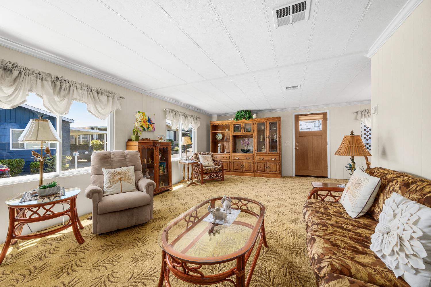 2435 Felt Street, Unit 24 Santa Cruz, CA 95062 - Photo 6 of 38 a living room with furniture windows and a table