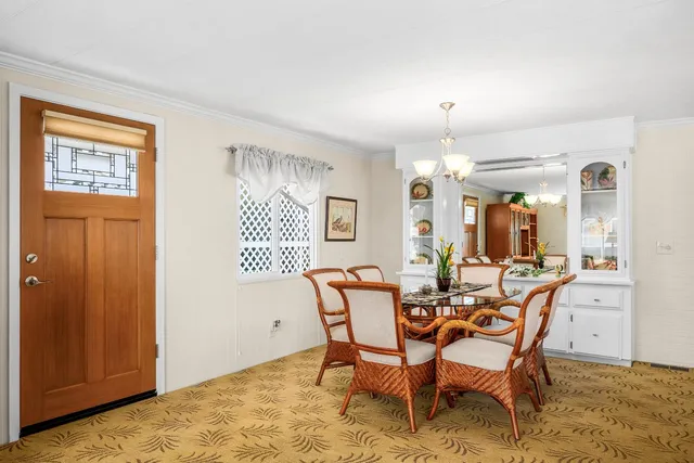 a dining room with furniture and window