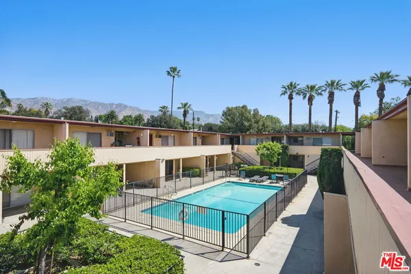 a view of a balcony with chairs