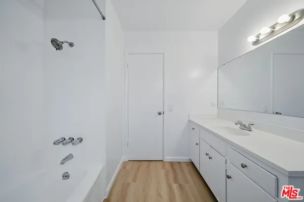 a bathroom with a sink and a bathtub