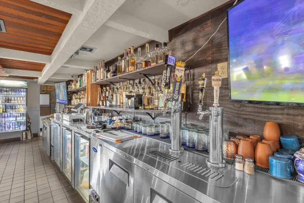 a kitchen with stainless steel appliances granite countertop a stove and cabinets