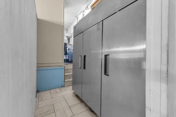 a bathroom with a shower and a sink