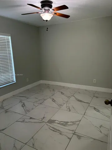 a view of a room with projector and cabinets