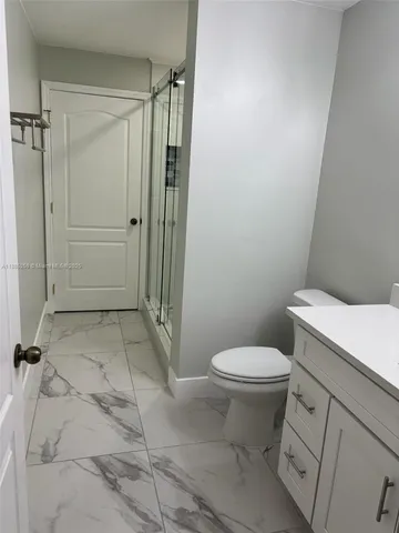 a bathroom with a sink and a toilet