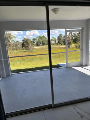 a view of a two room with a large window