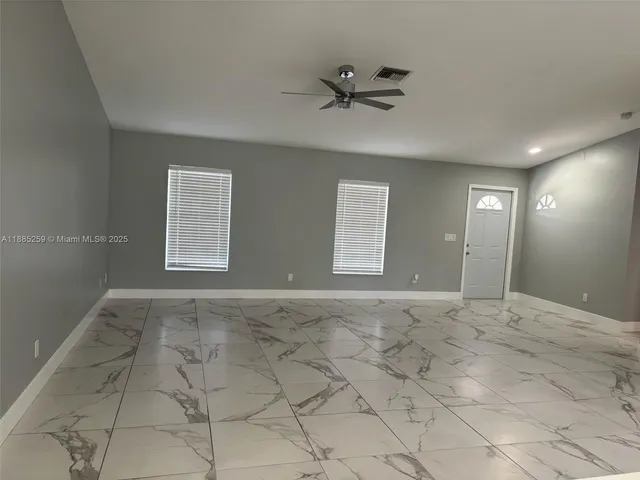 a view of an empty room with a window