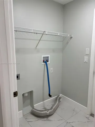 a view of a room with wooden floor and chair