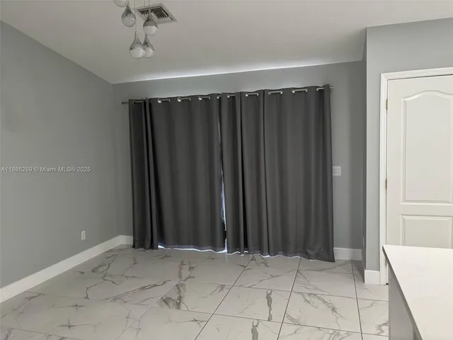 a view of a room with a window