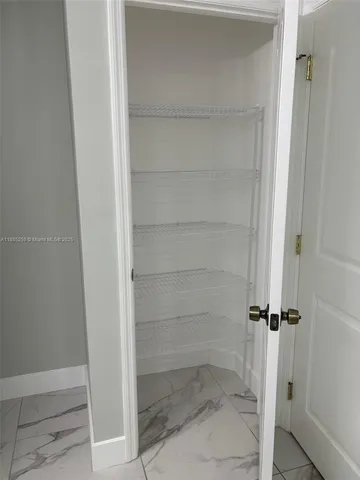 a bathroom with a glass door shower