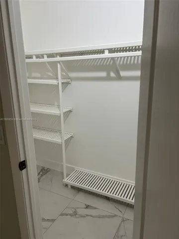 a view of a room with racks on the wall