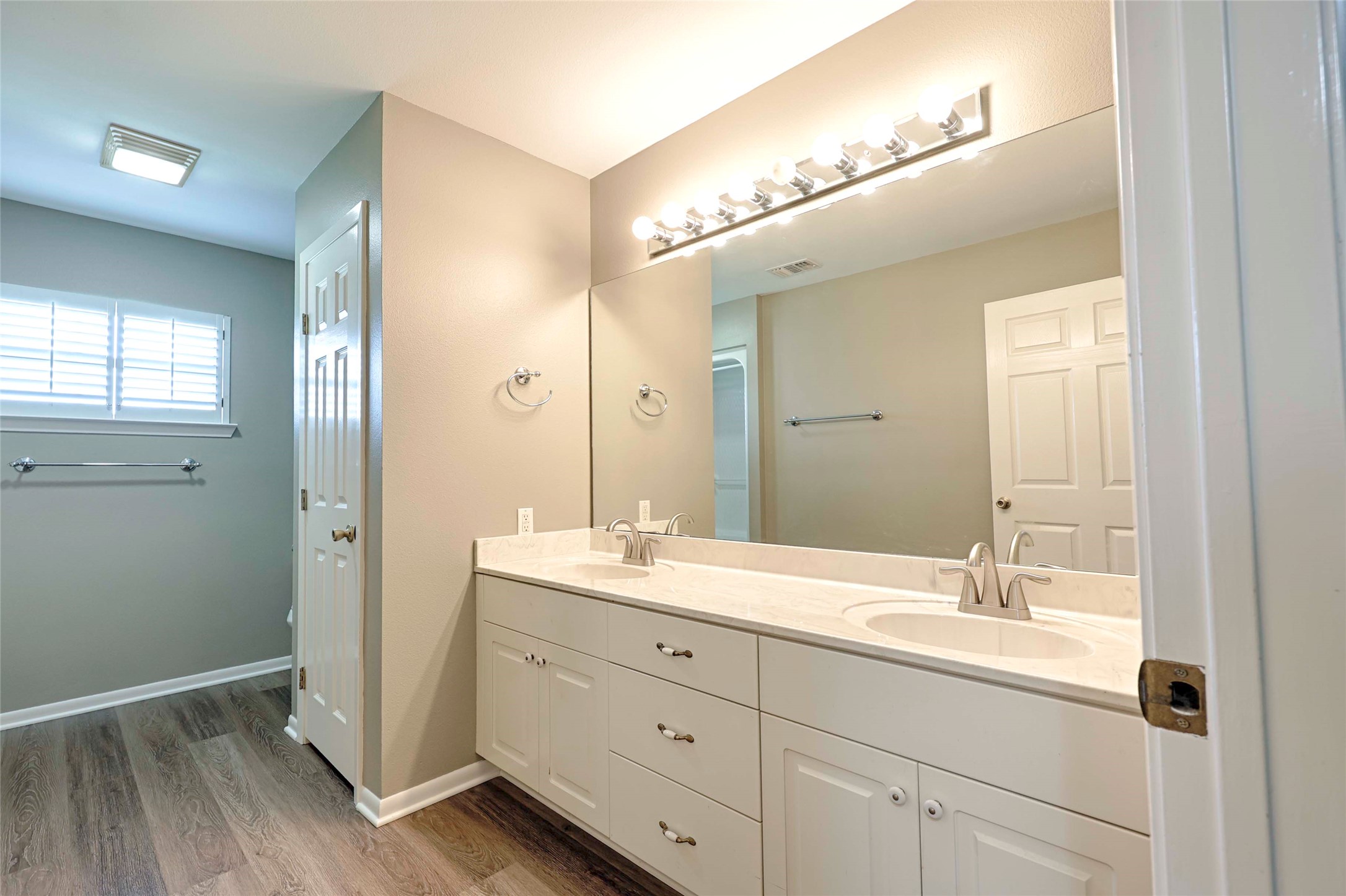3545 East I- 10 Frontage Road Schulenburg, TX 78956 - Photo 24 of 40 a bathroom with a double vanity sink and mirror with shower