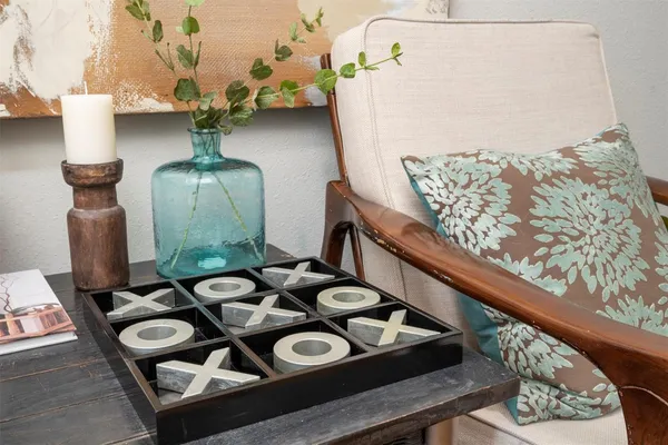 a table with chairs and a wooden floor