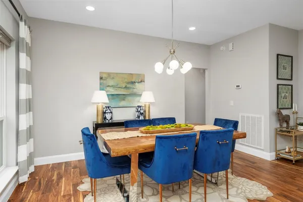 a view of a dining room with furniture and wooden floor