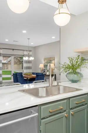a kitchen with stainless steel appliances a sink and a counter space
