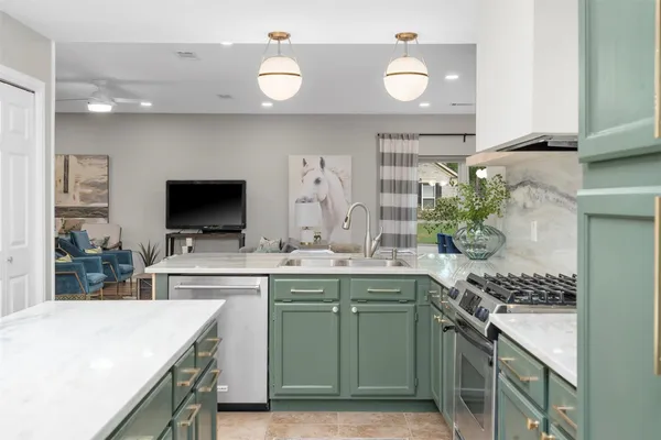 a kitchen with a sink and cabinets