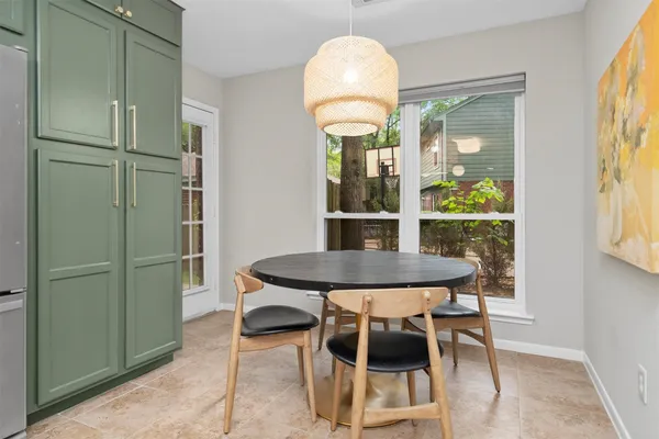 a view of a dining room with furniture window and outside view
