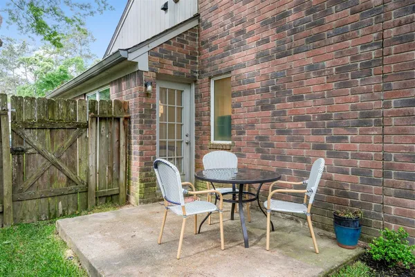 a patio with table and chairs