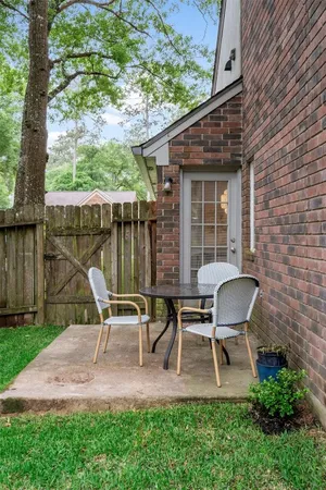 a view of a deck with wooden floor and outdoor seating