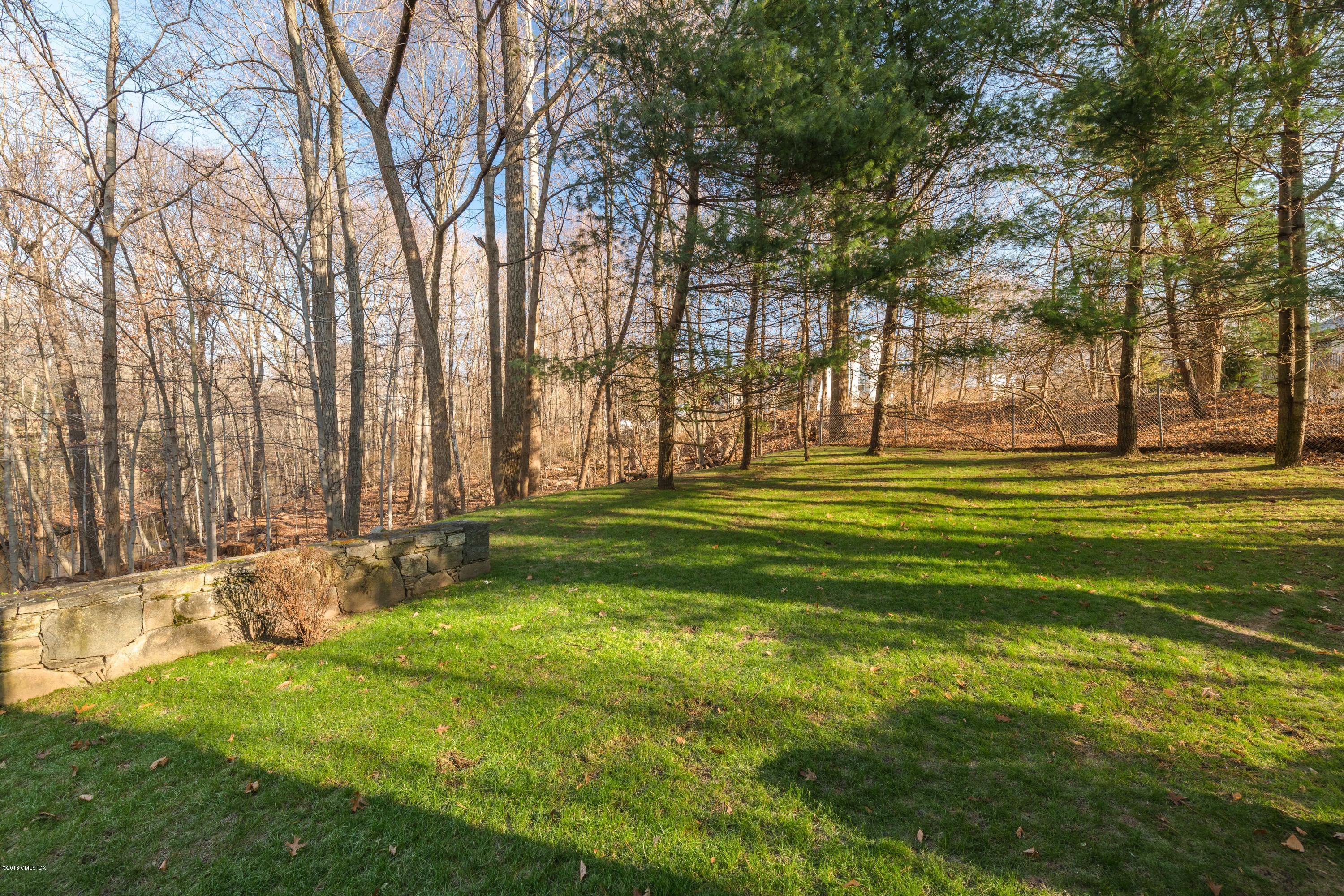 333 Palmer Hill Road, Unit 3D Riverside, CT 06878 - Photo 11 of 15 a swimming pool with outdoor seating and yard