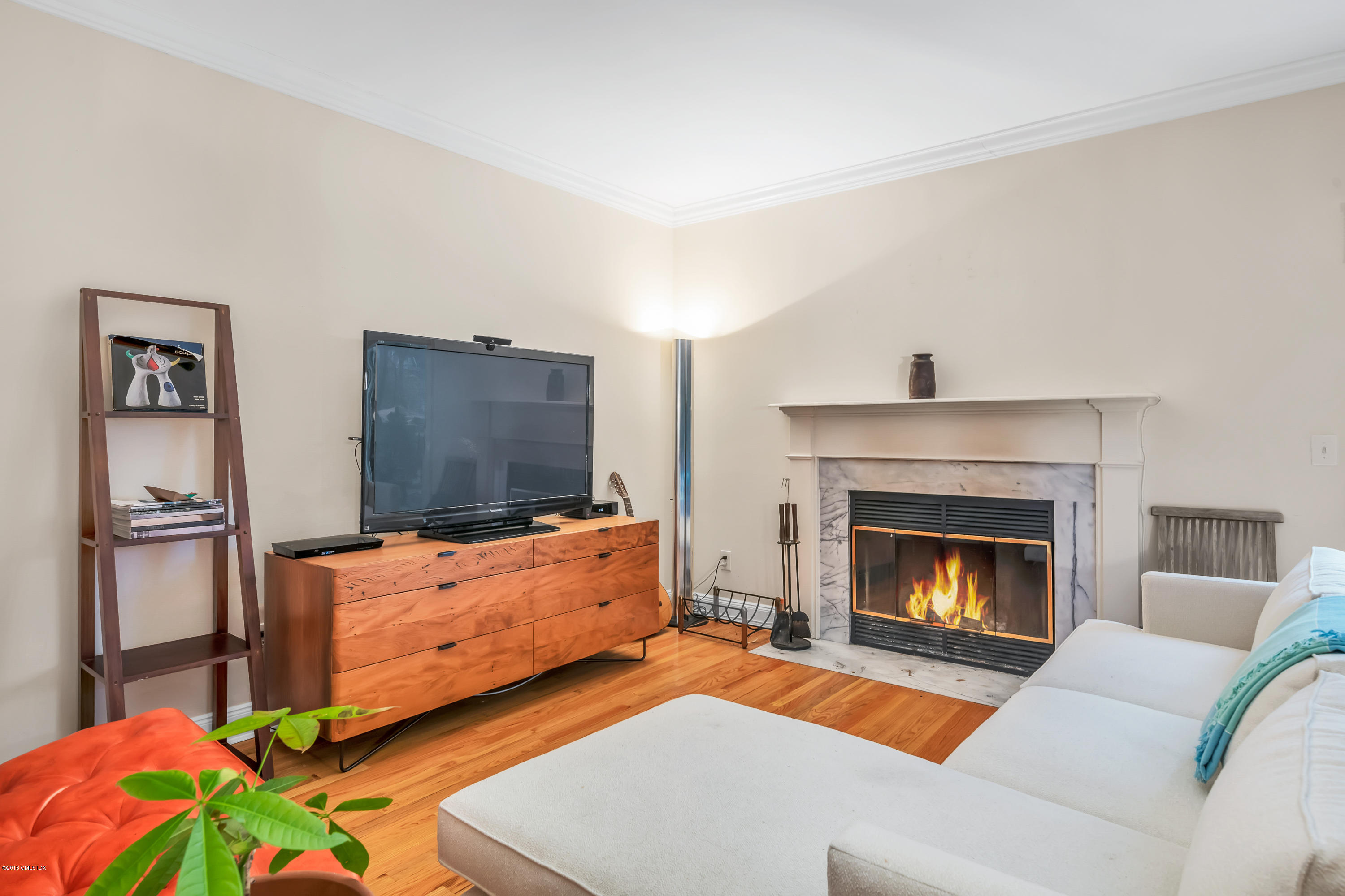 333 Palmer Hill Road, Unit 3D Riverside, CT 06878 - Photo 3 of 15 a living room with furniture and a fireplace