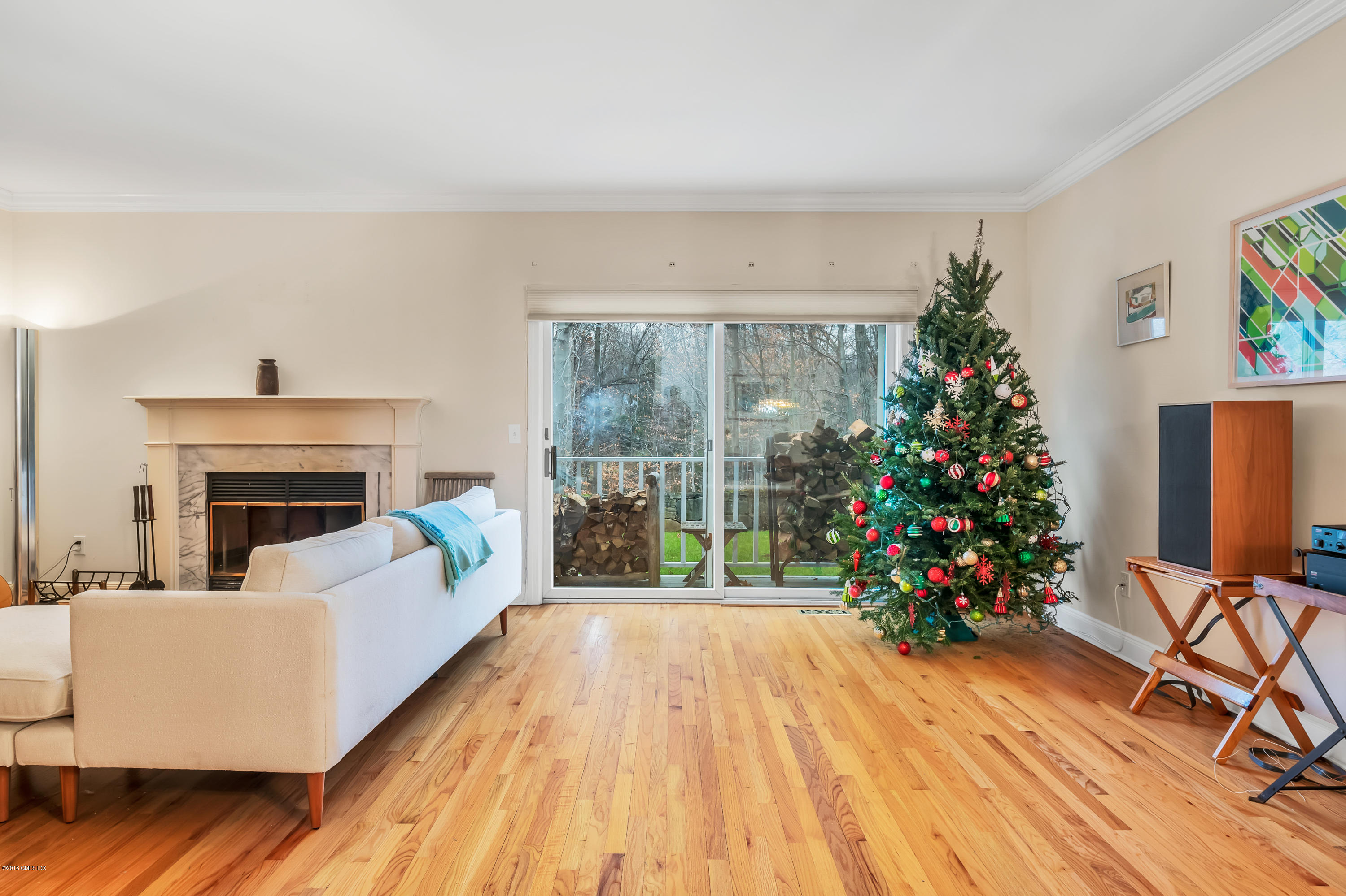 333 Palmer Hill Road, Unit 3D Riverside, CT 06878 - Photo 4 of 15 a living room with furniture a flower pot and a fireplace