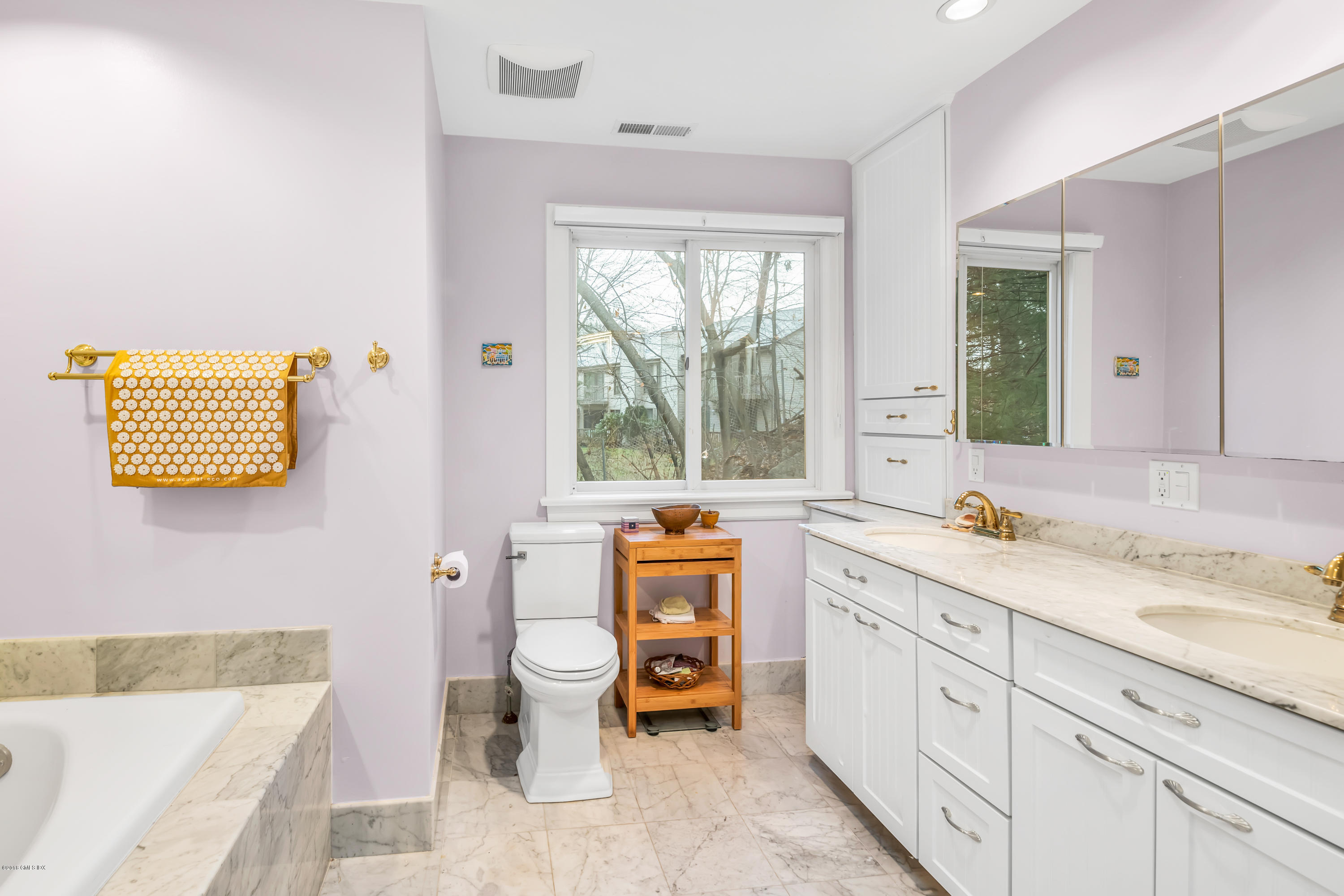 333 Palmer Hill Road, Unit 3D Riverside, CT 06878 - Photo 9 of 15 a spacious bathroom with a granite countertop sink a large mirror a bathtub and a window