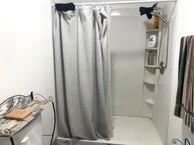 509 Ave I Sterling, IL 61081 - Photo 6 of 8 a bathroom with a shower and a sink