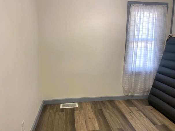 509 Ave I Sterling, IL 61081 - Photo 7 of 8 a view of room with window and wooden floor