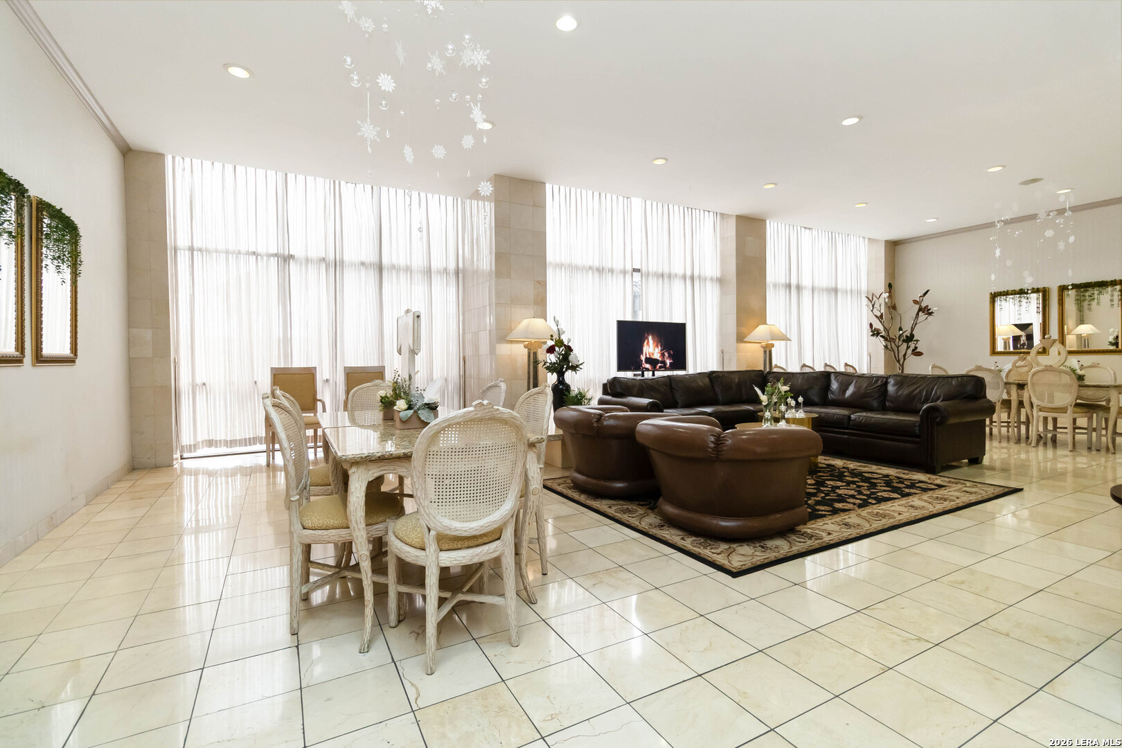 7701 Wurzbach Road, Unit 308 San Antonio, TX 78229 - Photo 11 of 17 a living room with furniture and a large window