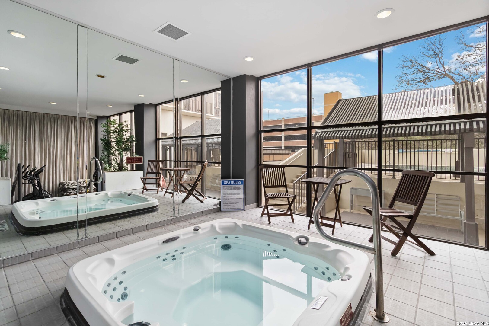 7701 Wurzbach Road, Unit 308 San Antonio, TX 78229 - Photo 15 of 17 a living room with furniture and a large window