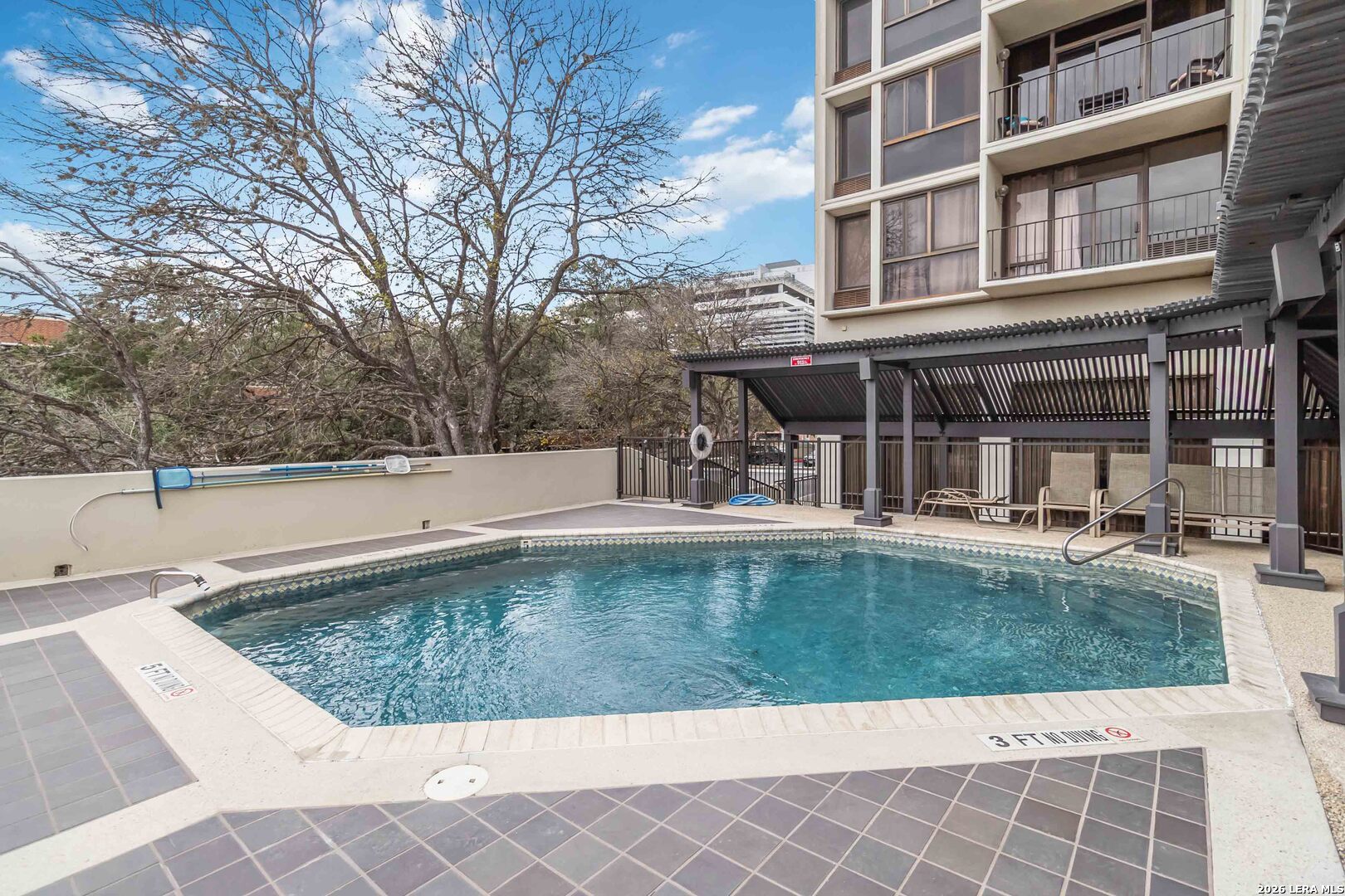7701 Wurzbach Road, Unit 308 San Antonio, TX 78229 - Photo 17 of 17 a view of a swimming pool with a patio