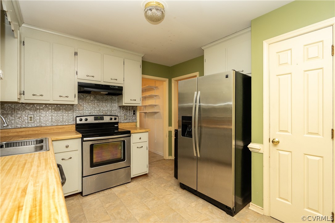 4624 Rabbit Foot Lane Chesterfield, VA 23236 - Photo 13 of 27 a kitchen with stainless steel appliances granite countertop a refrigerator and a stove