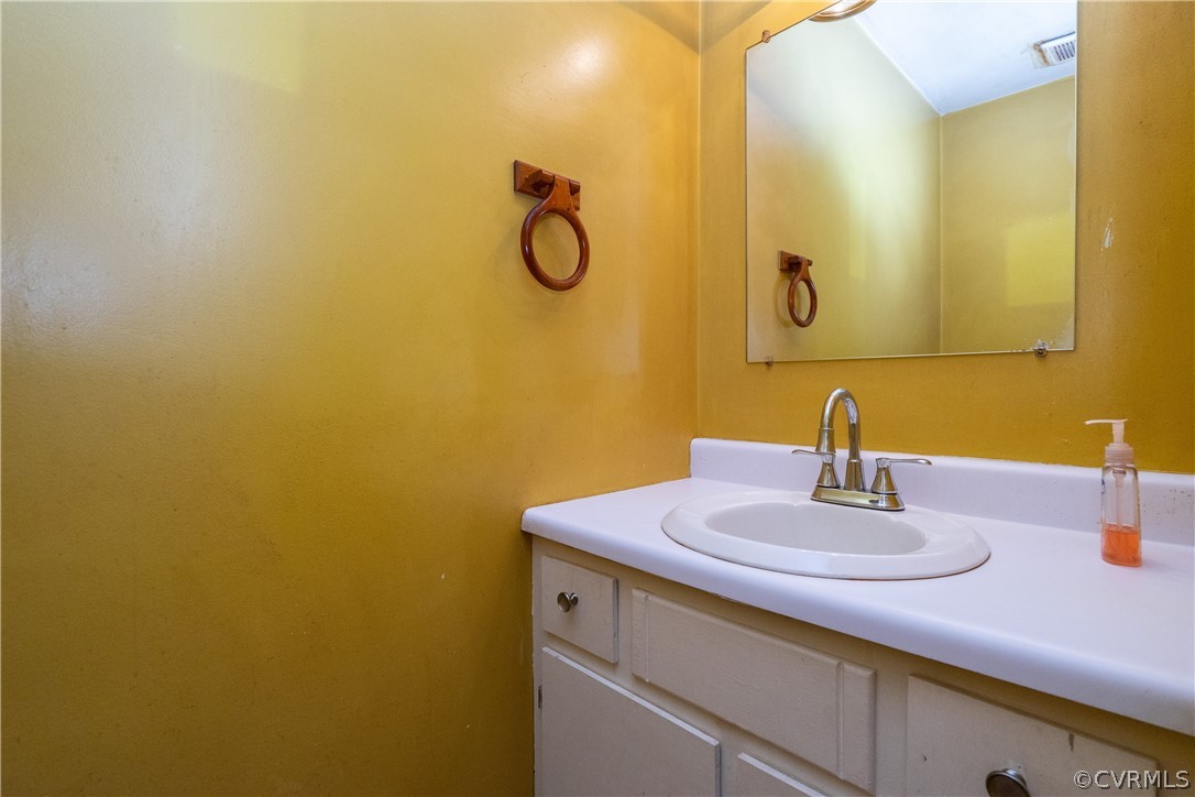 4624 Rabbit Foot Lane Chesterfield, VA 23236 - Photo 15 of 27 a bathroom with a sink and a mirror